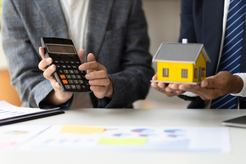 Businessman are meeting to discuss the returns of real estate investments
